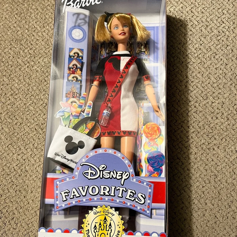 Disney exclusive Barbie.  Never been out of box.  Box has a crinkle as…